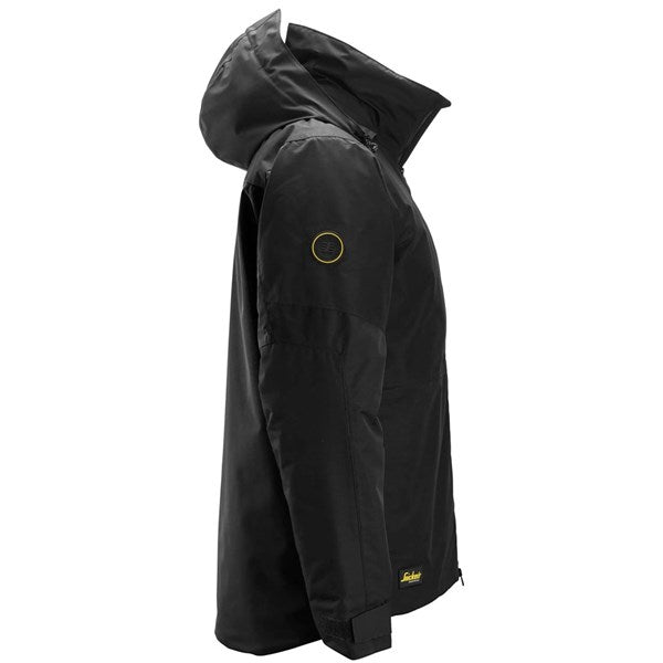 Snickers Insulated Jacket in black shown from the side with hood up and logo patches on sleeve and hem