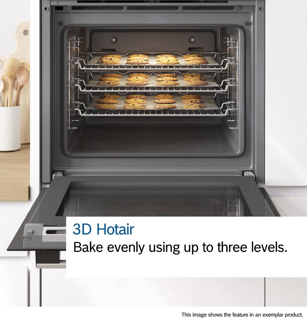 Bosch stainless steel single oven with three racks baking multiple trays of cookies evenly.