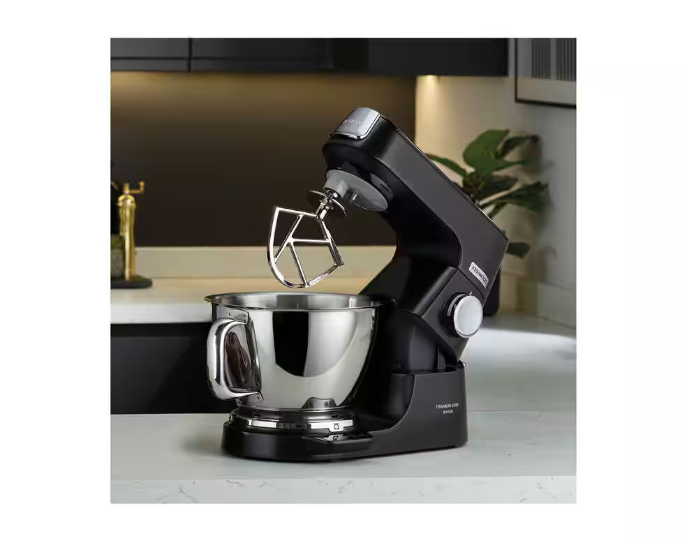 Kenwood KVC85.004BK Titanium Chef Baker black stand mixer with stainless steel bowl and beater attachment on countertop