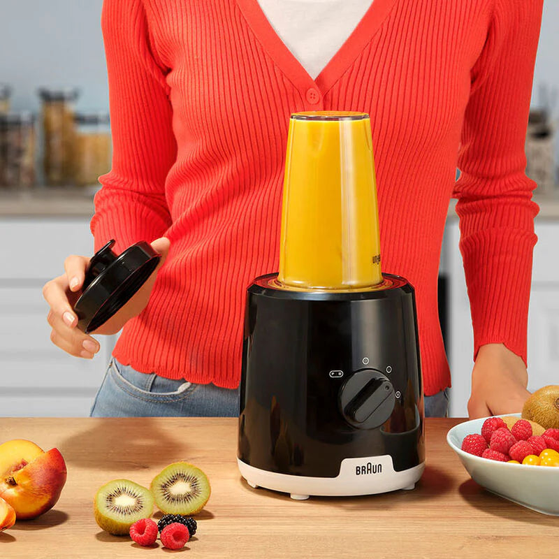 Braun Power Blender JB1051BK with a blending cup filled with orange smoothie on a kitchen counter.