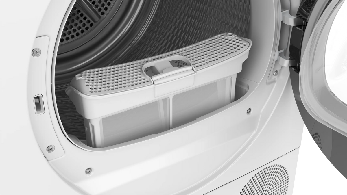 Close-up of the Bosch Serie 6 9KG heat pump tumble dryer lint filter inside the open drum.