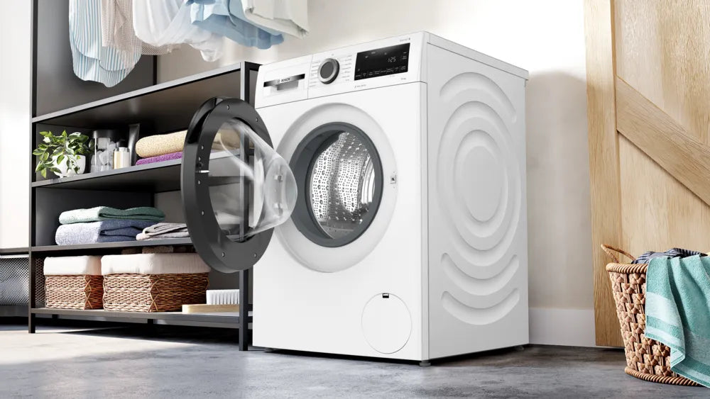 Bosch 10kg washing machine with open front door, digital display, and textured side panels in a laundry room.