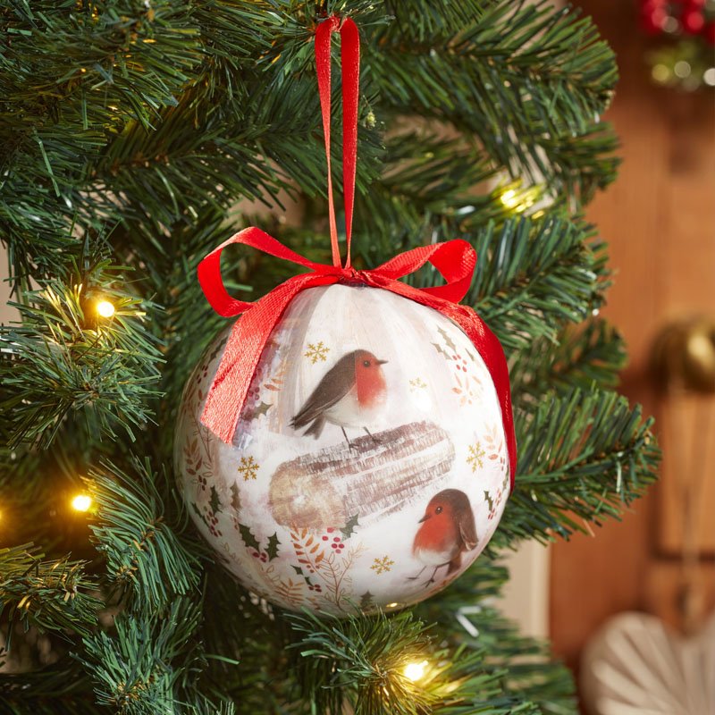 12cm vintage bauble with robin bird design and red ribbon hanging on Christmas tree branch