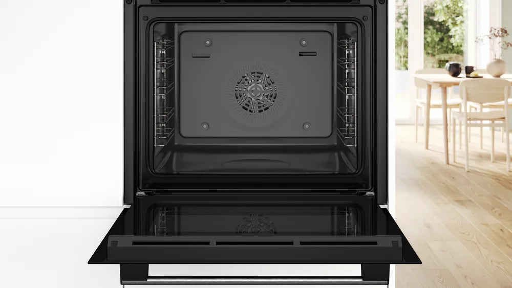 Bosch single oven in stainless steel with open door showing empty interior and fan at the back