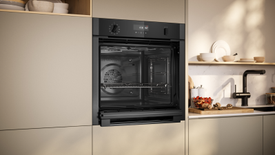 NEFF Graphite N50 Slide & Hide single oven installed in a modern kitchen with the door fully open.