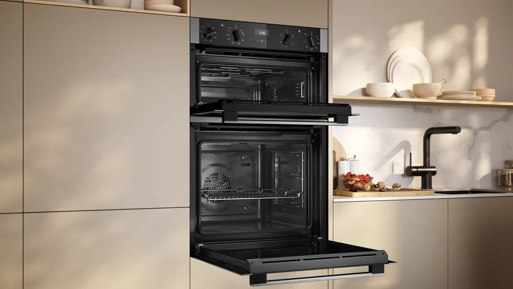 Neff N50 CircoTherm double oven in stainless steel with both doors open, installed in a modern kitchen.