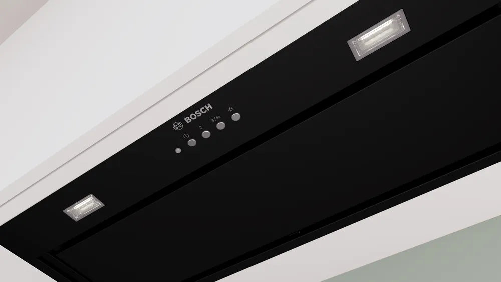 Close-up of the black Bosch Series 6 canopy cooker hood control panel with buttons and two lights.