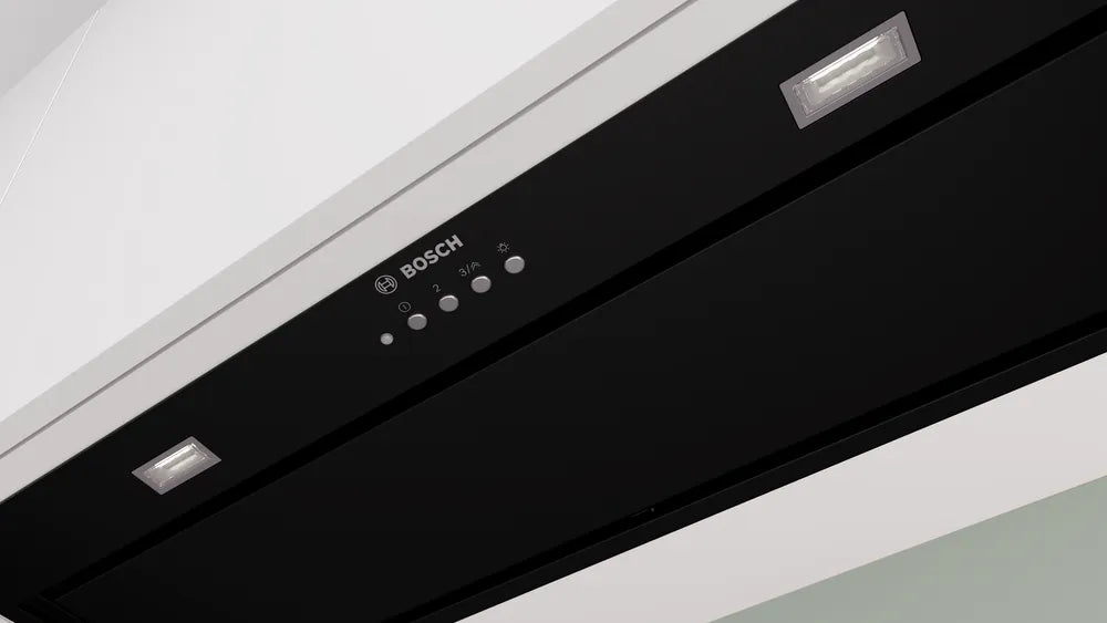 Close-up of Bosch Series 6 black canopy cooker hood control panel and built-in lights.