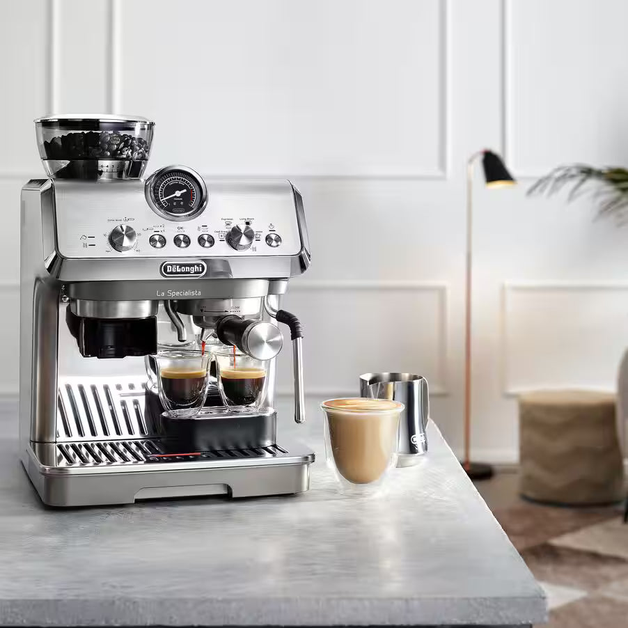 DeLonghi La Specialista Arte Evo espresso machine brewing two shots with milk frother and latte on counter