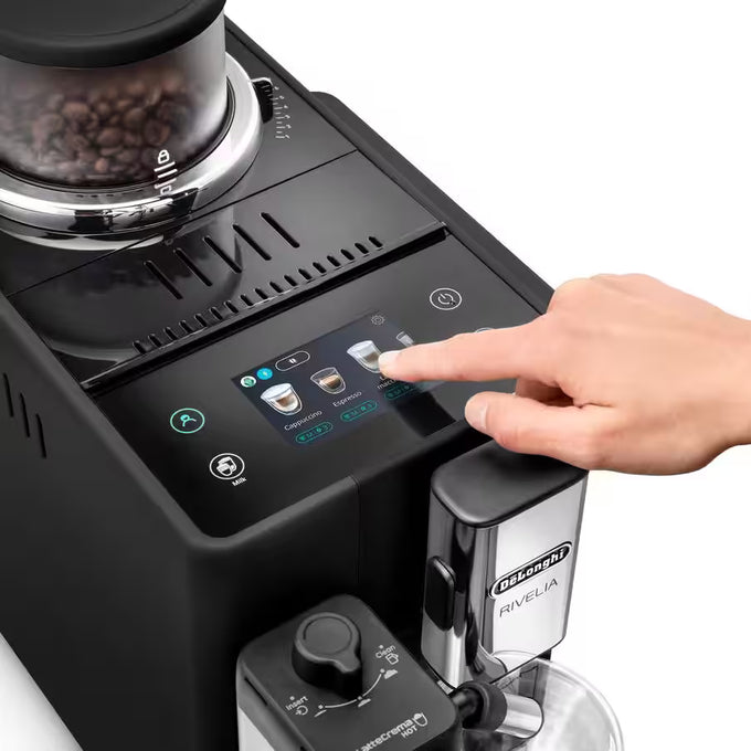 Coffee machine with a hand interacting with the touch screen interface