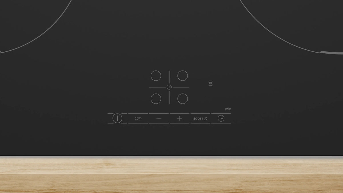 Bosch Series 4 60cm matt black induction hob with touch controls on a wooden countertop
