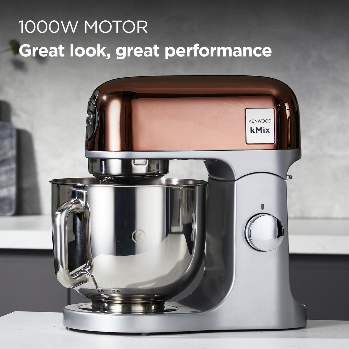 KENWOOD kMix kitchen mixer in rose gold with stainless steel mixing bowl on white countertop