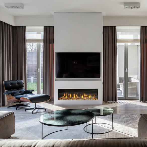 Dimplex Ignite Bold 60″ built-in electric fire with glowing flames below a wall-mounted TV in a modern living room.