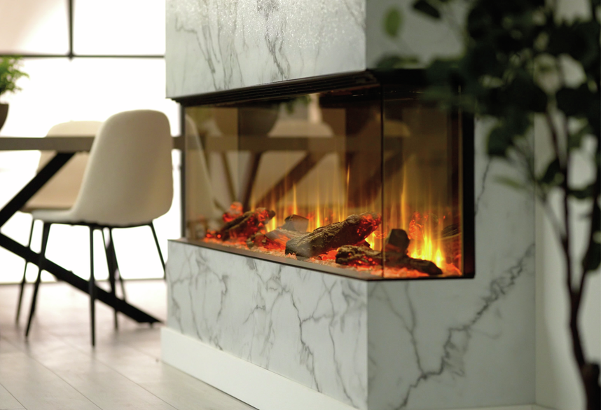 Dimplex Ignite Ultra 74 electric fireplace with glowing logs and flames in a marble surround, side view.