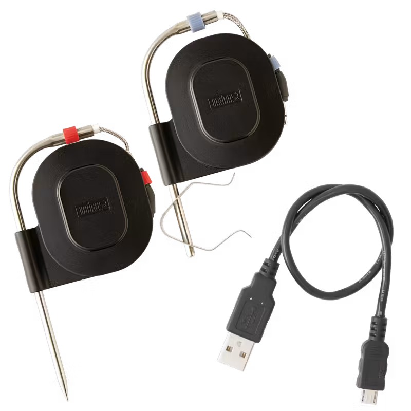Two Weber Connect Smart Grilling Hub temperature probes with red and blue clips and a USB charging cable.