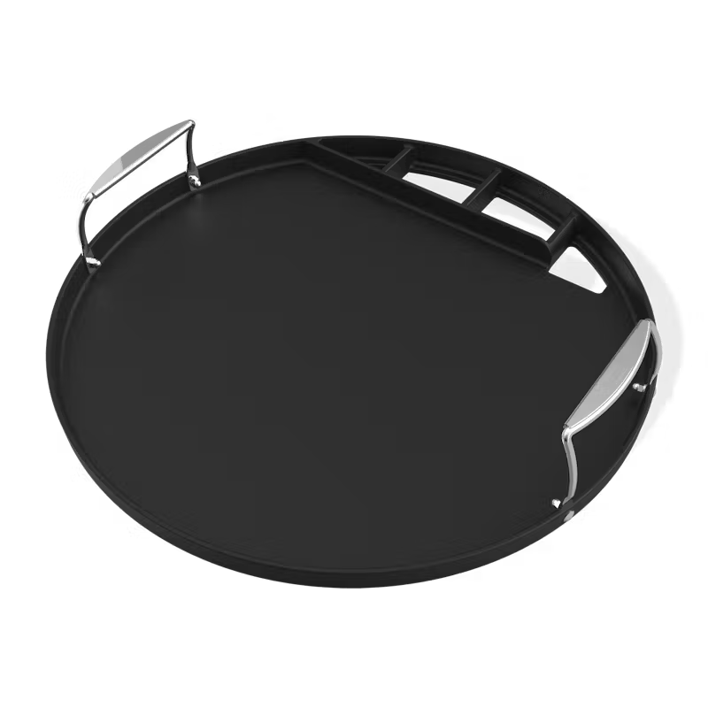 Round black porcelain-enameled cast iron Weber griddle with stainless steel handles and rear grease channel.