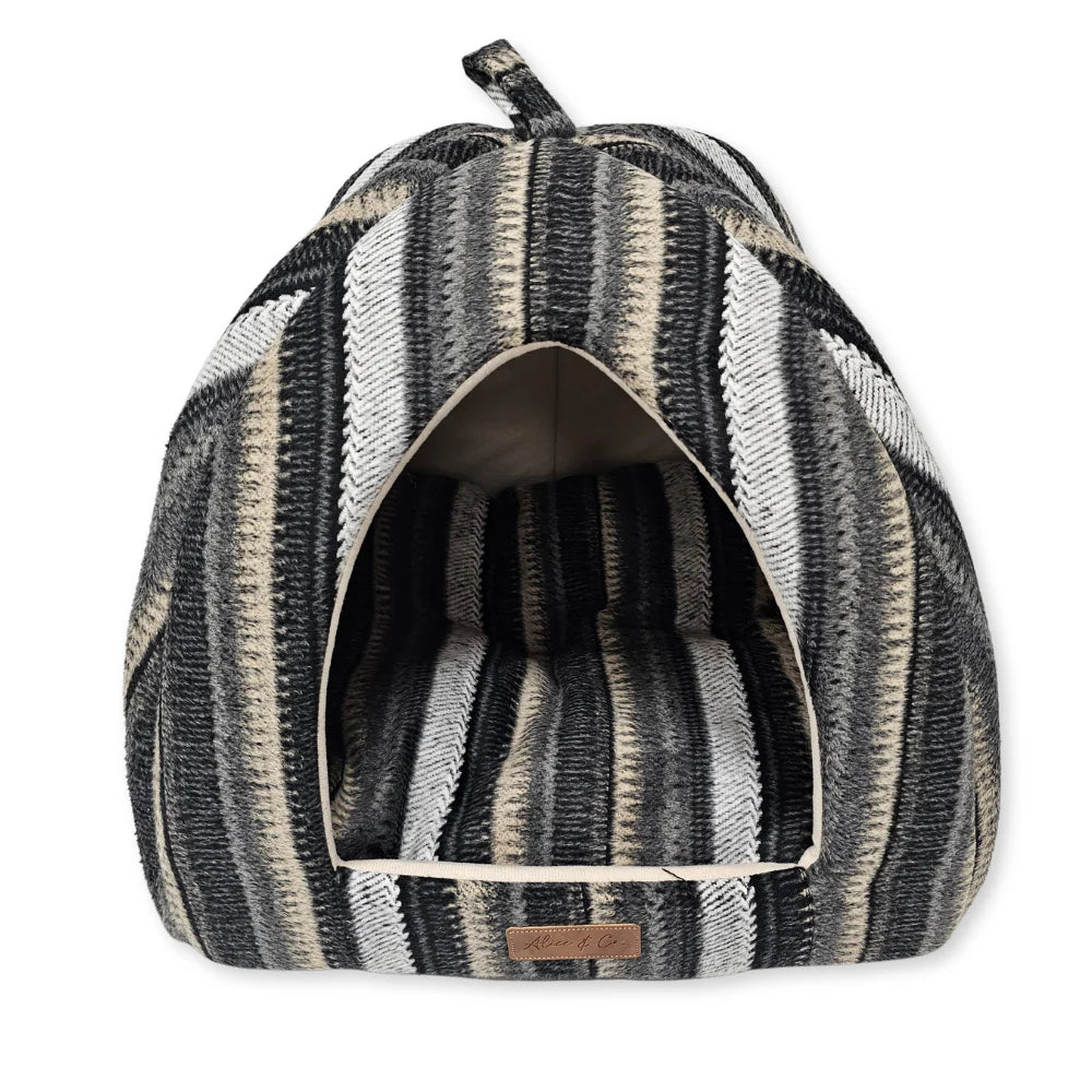Triangle-shaped hooded pet bed with black, gray, and beige striped fabric for cats and dogs.