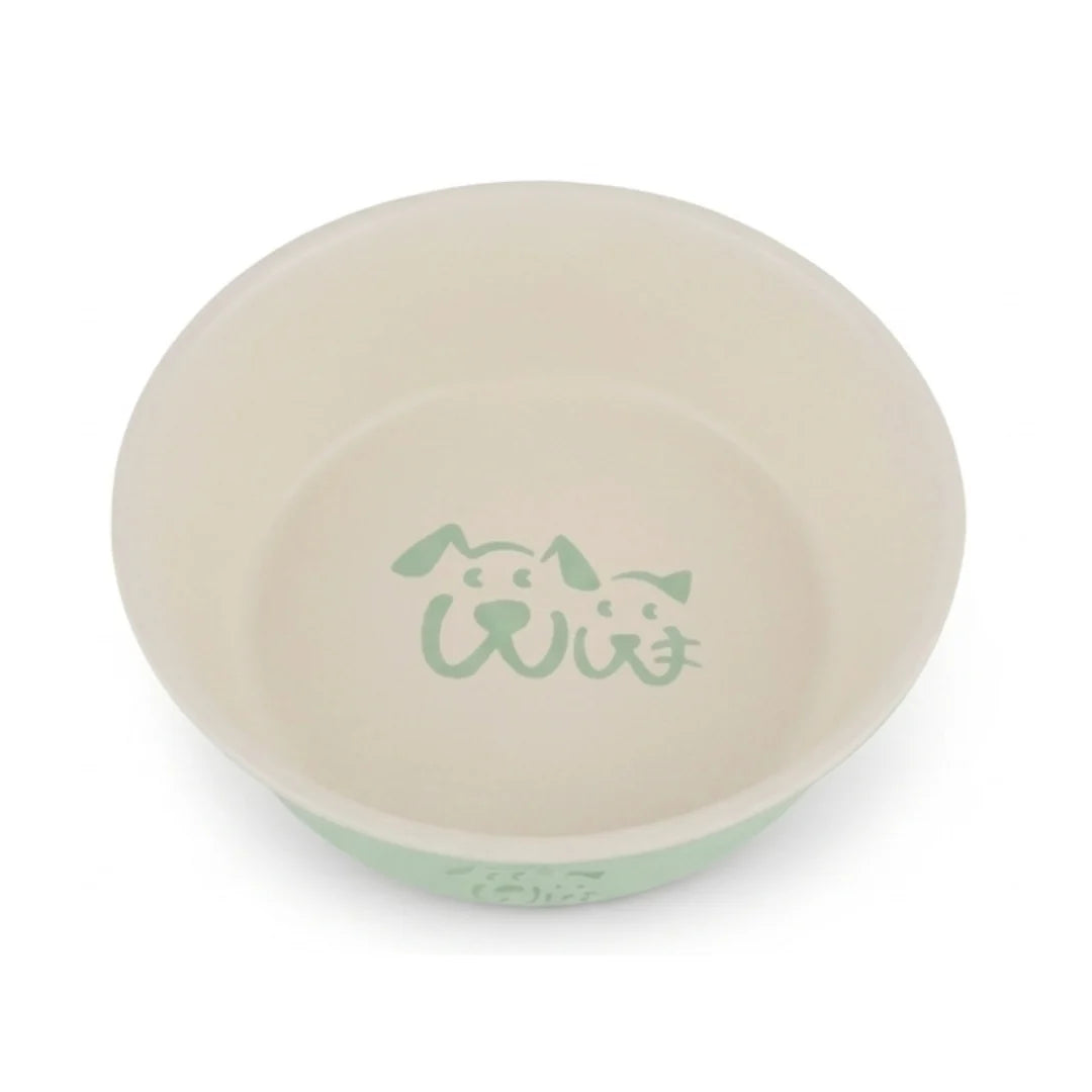 Wiggle & Wander green dog bowl with simple dog and cat face illustration inside and on the side.