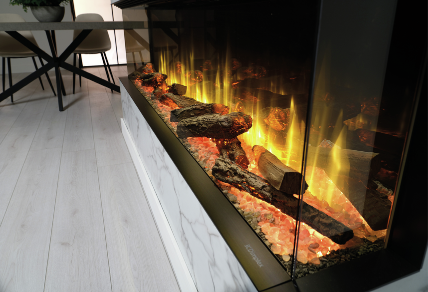 Dimplex Ignite Ultra 60 electric fireplace with glowing logs and yellow flames in a modern room corner