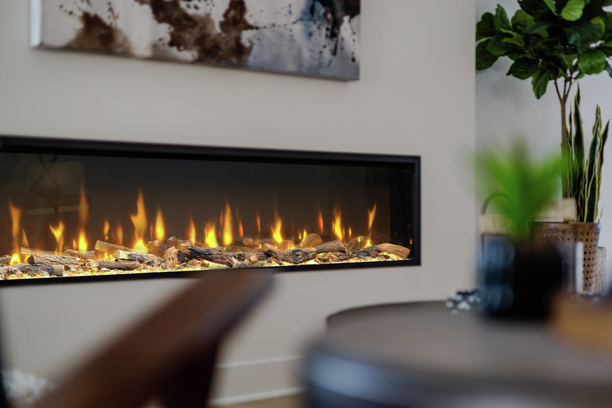 Dimplex Ignite Bold 60″ built-in electric fire with glowing logs and realistic flames in a modern living room wall.