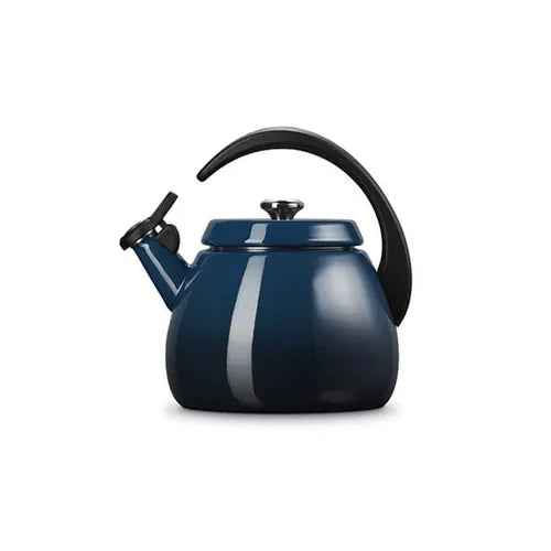 Le Creuset Cloche Kettle 2.1L in Nuit blue with black handle and whistle spout, side view on white background