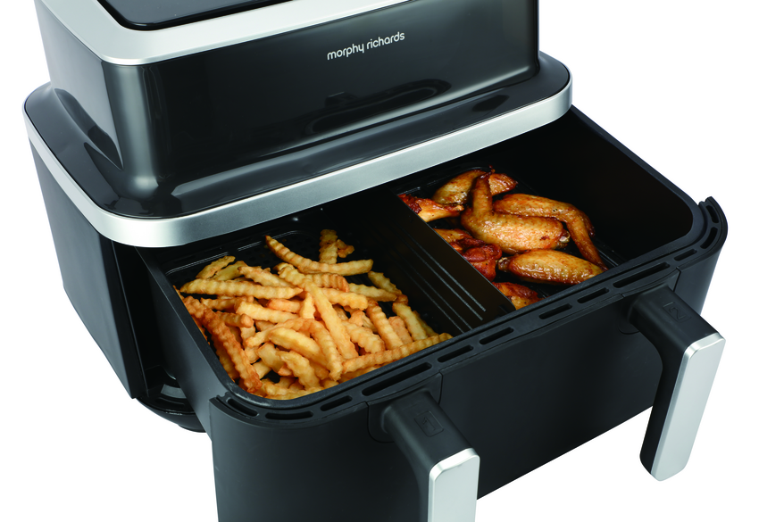 Morphy Richards 9L Airfryer with flex drawer open, showing cooked fries and chicken wings inside.