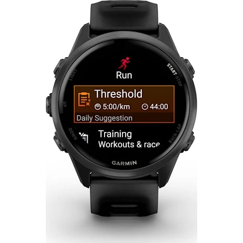 Garmin Forerunner 570 smartwatch in slate grey showing run workout screen with threshold pace and time details.
