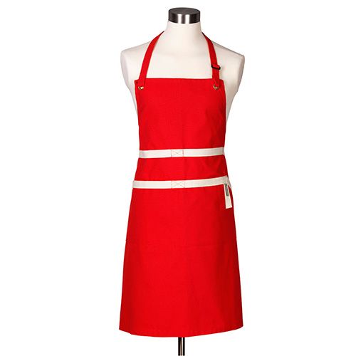 Le Creuset Cerise Chef's Apron with adjustable neck strap, deep pockets, and hand cloth loop – available at Keans