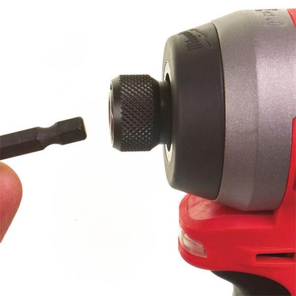 Close-up of Milwaukee Shockwave Socket Adaptor attached to a red power tool with a hand holding a hex bit nearby.