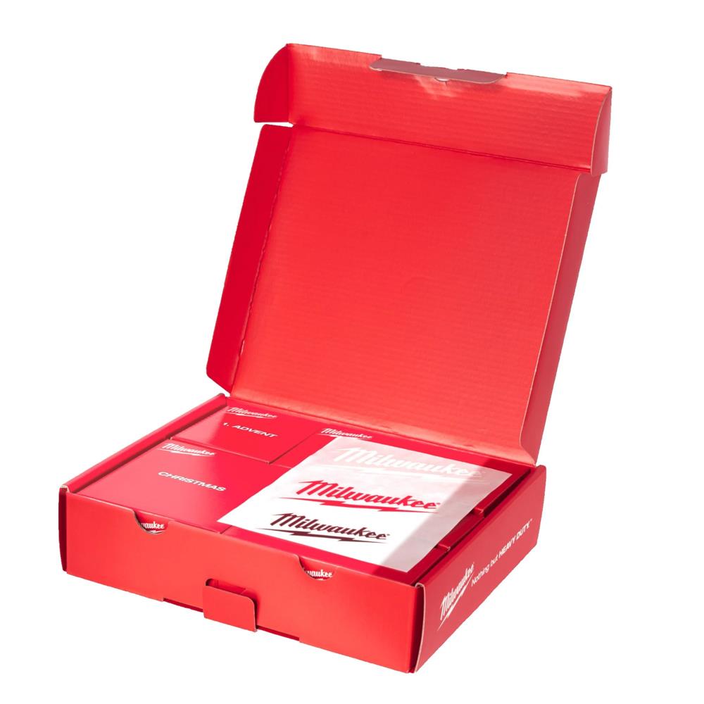 Open red Milwaukee Christmas Promo Box with branded cards and stickers inside.