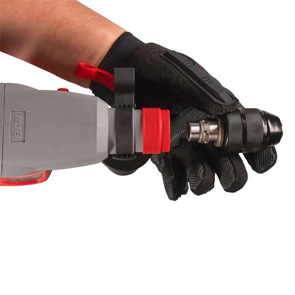 Hand in black glove holding Milwaukee M18BLHX-0 brushless hammer drill with FIXTEC chuck close-up on white background.