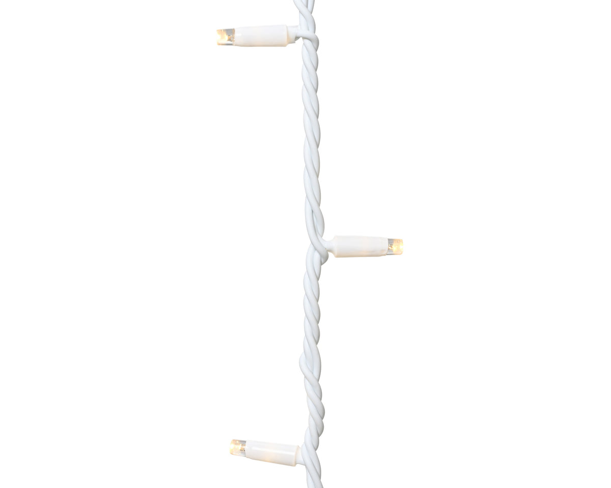 Close-up of three warm white LED bulbs on a twisted white cable from LED Pro-Lights Icicle Lights extension set
