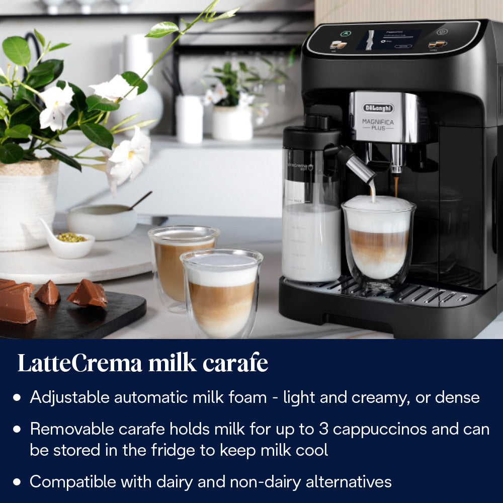 DeLonghi Magnifica Plus coffee machine in black with milk carafe frothing milk into a glass cup on a kitchen counter.