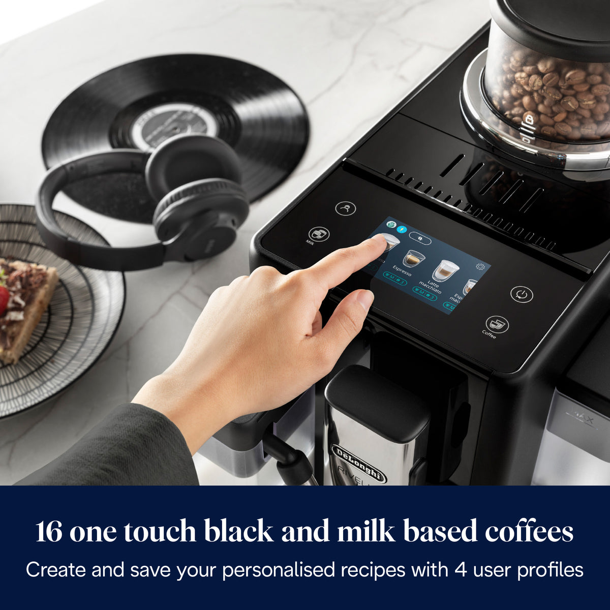 Close-up of DeLonghi Rivelia coffee machine touchscreen with hand selecting espresso option and visible bean container.