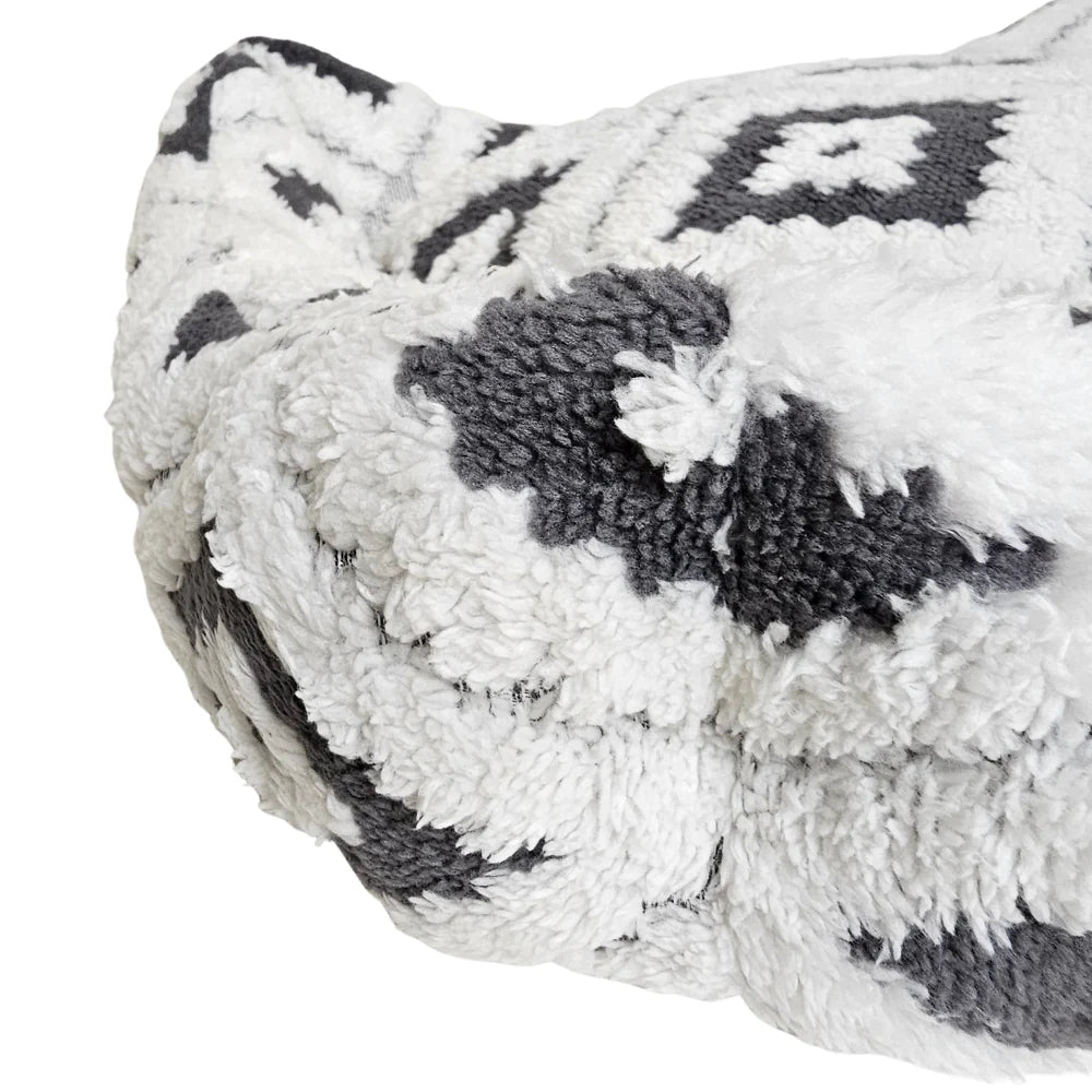 Close-up of the soft, textured fabric and boho grey pattern on the Wiggle & Wander dog bed corner.