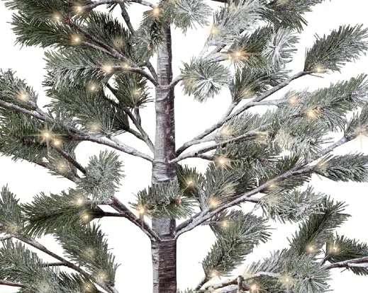 Close-up of LED Snowy Pine Outdoor Tree branches with frosted needles and warm white lights.