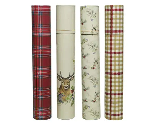 Four decorative cylindrical tins or bottles standing upright on a white background, each with a different pattern: red tartan, cream with a deer illustration, cream with floral print, and beige gingham with red stripes.