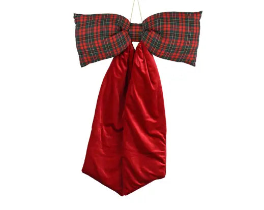 Red velvet bow with plaid pattern on a white background