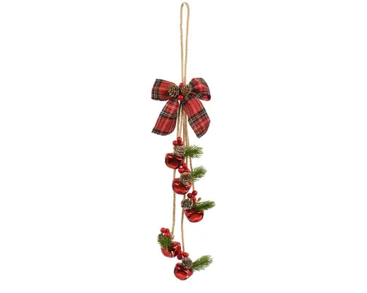 A hanging Christmas ornament featuring a red and green plaid ribbon bow, small pinecones, red bells, and green pine branches on a gold string, shown against a plain white background.