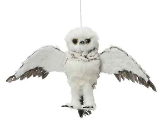Plush toy owl with open wings on a white background