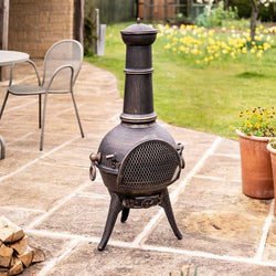 Grande Clasico Chimenea outdoor cast iron fire pit with bronze finish, fuel grate, and easy assembly – Keans Claremorris
