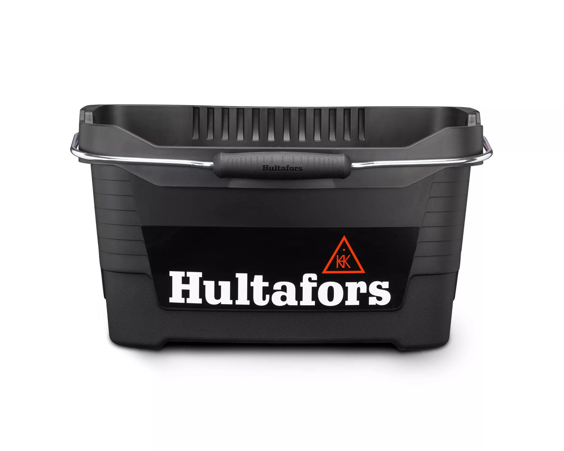 Black Hultafors tool bucket with metal handle and rubber grip, front view showing logo and textured sides.