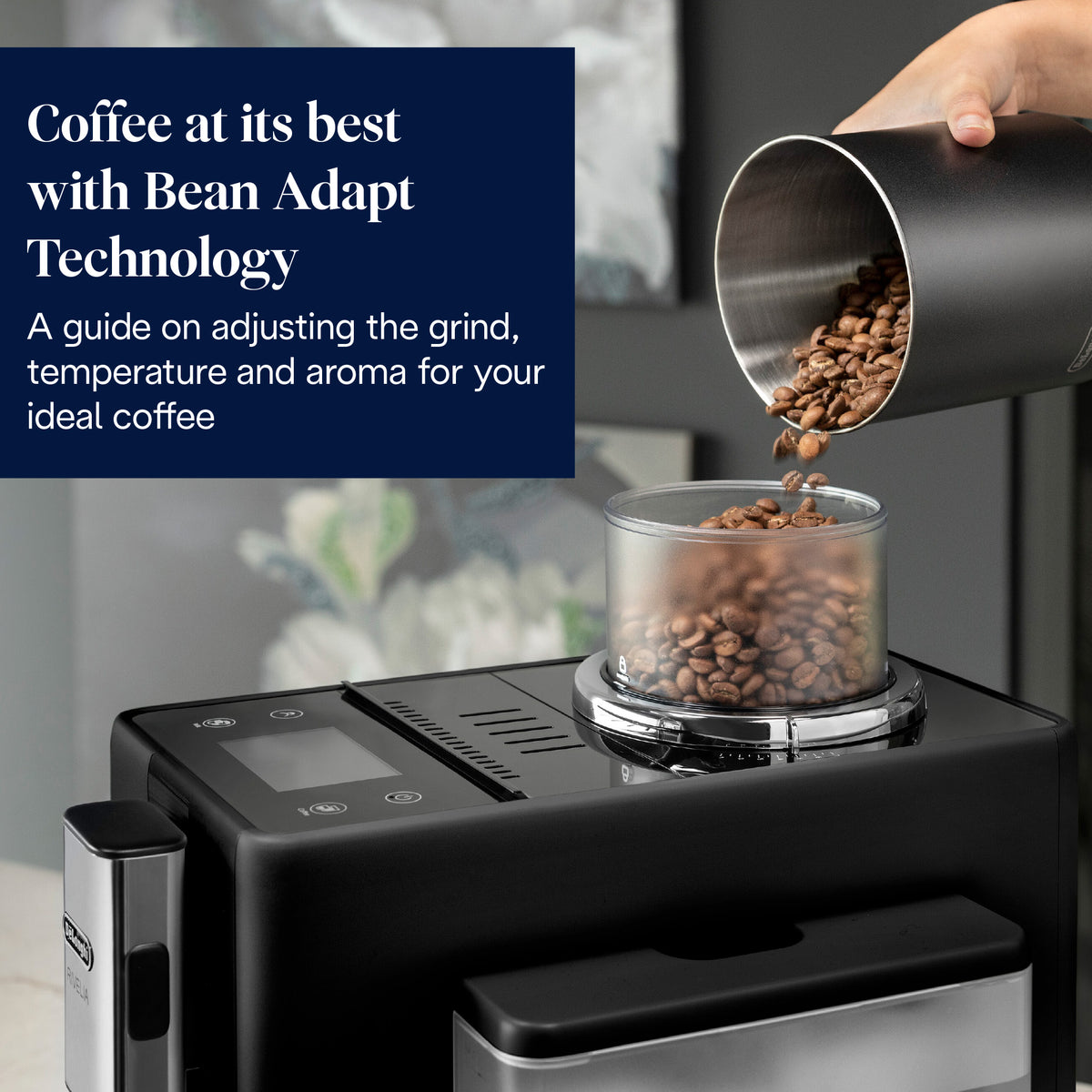 Close-up of DeLonghi Rivelia Auto Bean Coffee Machine black model showing bean container being filled with coffee beans.