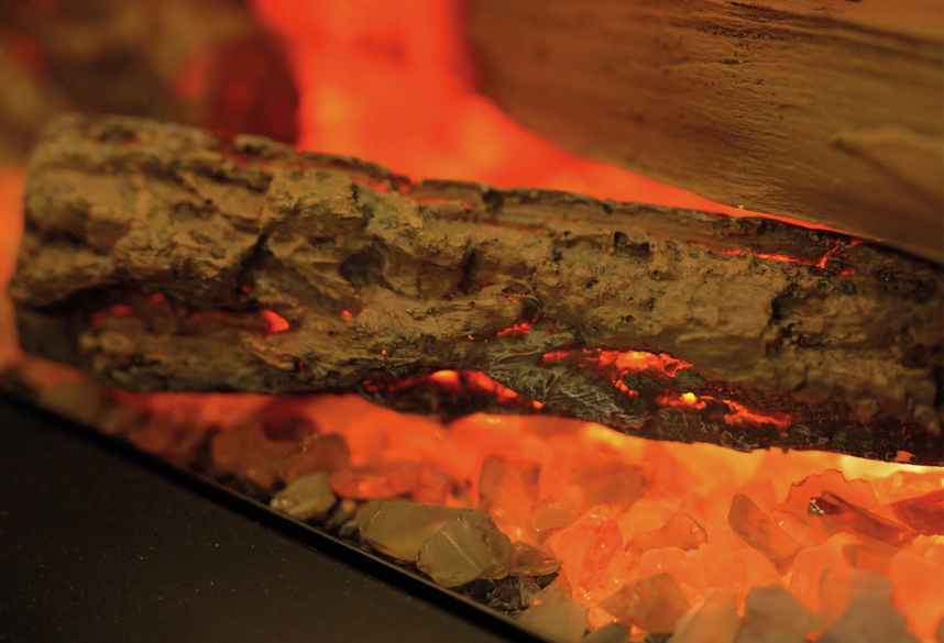 Close-up of glowing embers and logs in the Dimplex Ignite Ultra 60 electric fireplace.