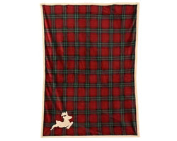 A red and green plaid blanket with a beige border and a small beige dog silhouette near the bottom left, shown flat against a white background.