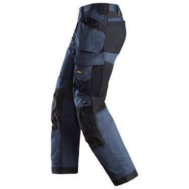 Side view of navy and black Snickers 6251 stretch loose fit work trousers with holster pockets.