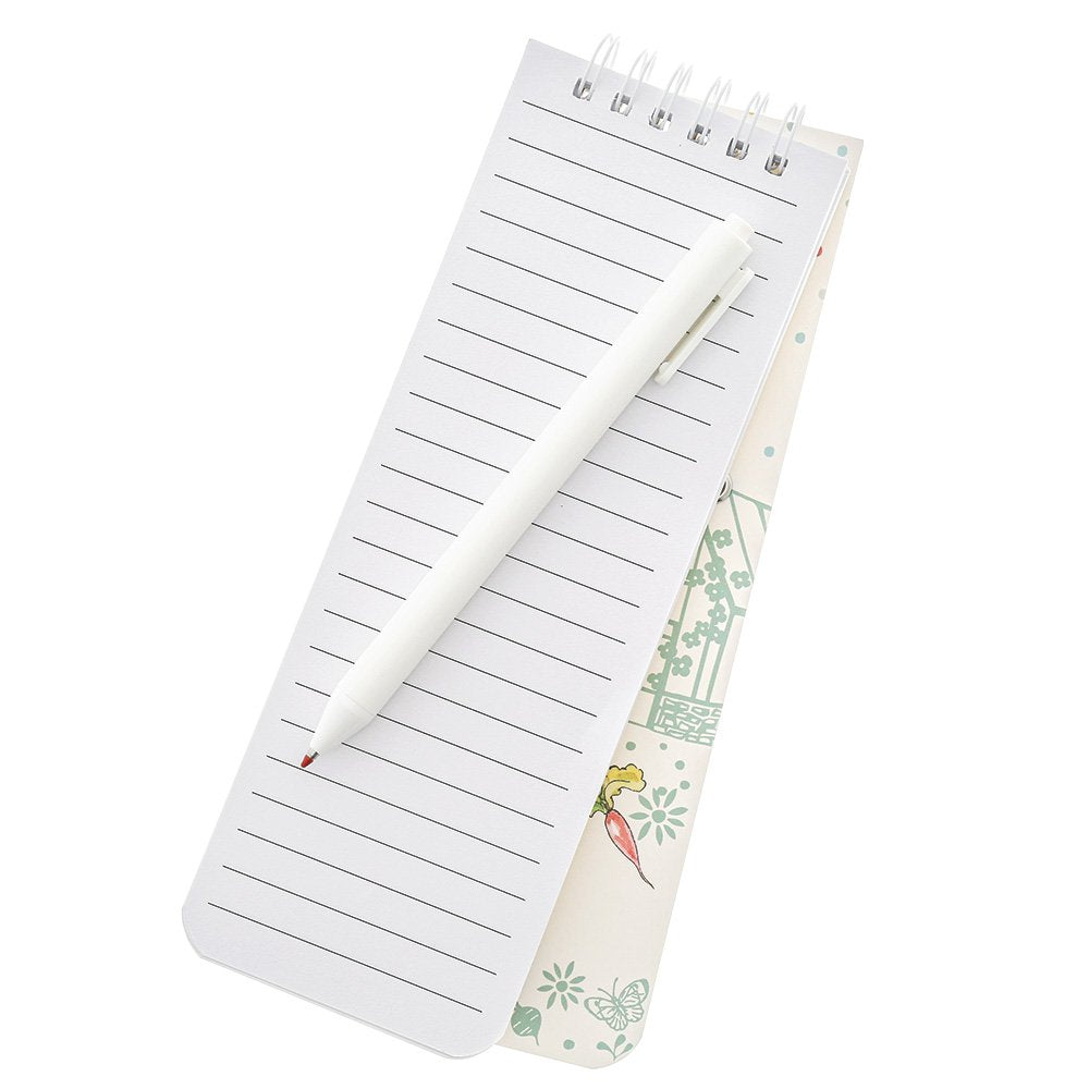 Peter Rabbit notepad with lined pages and a white pen resting on top, showing part of the illustrated cover.