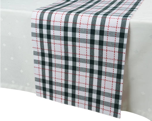 Green and white check rectangular cotton table runner with red stitched accents on a white tablecloth