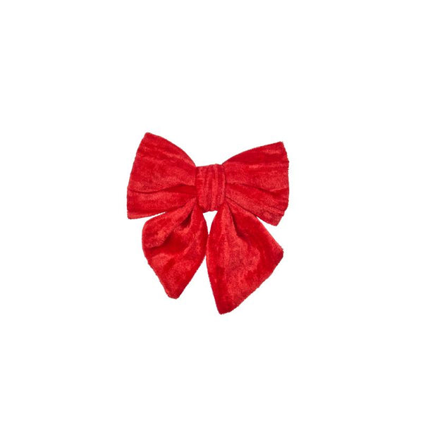 A bright red velvet bow accessory, likely for a costume or costume hat, centered on a plain white background.