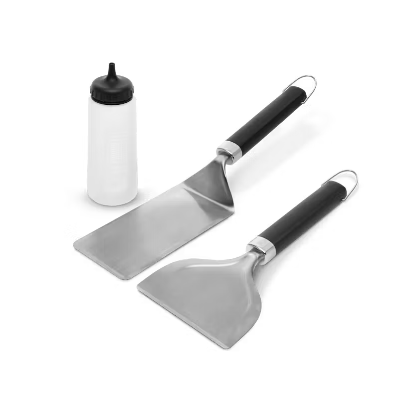 Weber Griddle 3-Piece Starter Set with two stainless steel spatulas and a white squeeze bottle with black cap.